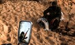 Palestinian militants of Al-Nasir brigades shoot during a military graduation ceremony in...