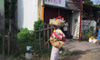 Woman carrying a basket on her head in the city of Thiruvananthapuram (Trivandrum), Kerala...