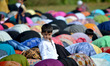 Kashmiri Muslims offer Eid-ul-Adha festival Prayers, in Srinagar, the summer capital city...