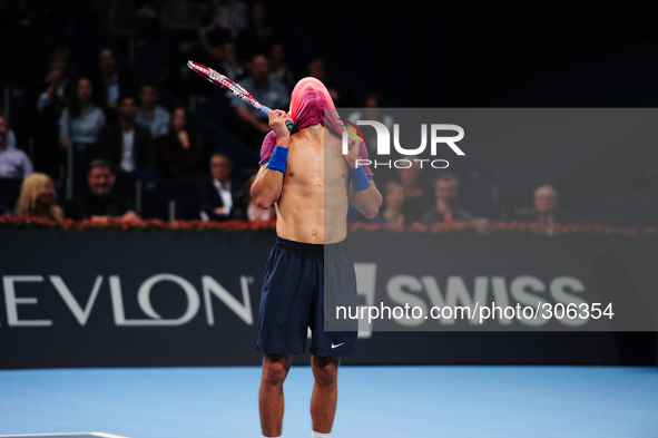 Borna Coric (CRO) covers his head with his shirt after loosing a point during the semi final of the Swiss Indoors  at St. Jakobshalle in Bas...