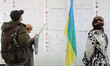 KIEV, UKRAINE - OCTOBER 26: People come to the polling station to vote for their candidate...