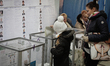 KIEV, UKRAINE - OCTOBER 26: People come to the polling station to vote for their candidate...