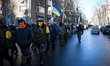 Anti-government opposition activists march around the "government quarter", including the...