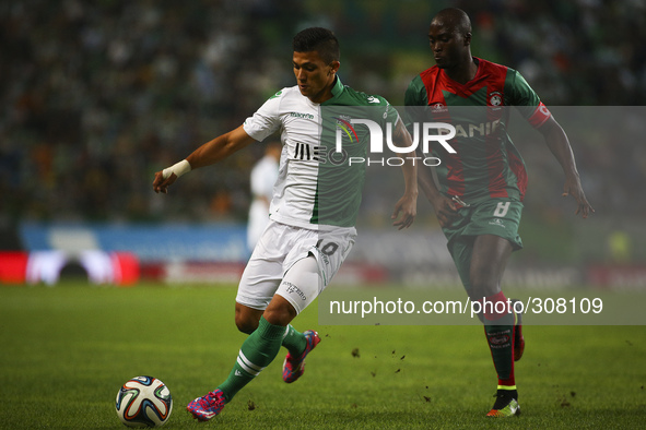 Sporting´s forward Fredy Montero (L) vies with Maritimo's midfielder Danilo Pereira during the Portuguese League football match between Spor...