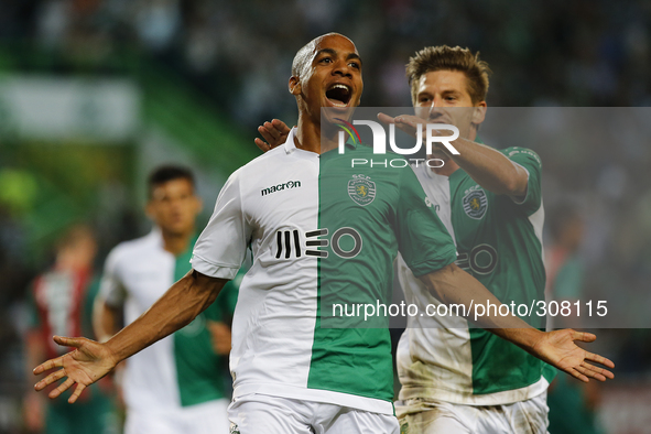 Sporting's midfielder Joao Mario (L) celebrates his goal (2-0) with Sporting's midfielder Adrien Silva (R)  during the Portuguese League  fo...