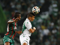 Sporting's forward Fredy Montero (R) heads for the ball with Maritimo's defender Gege (L)  during the Portuguese League  football match betw...