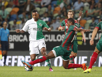 Sporting's midfielder Nani (L) vies with Maritimo's defender Gege (R)  during the Portuguese League  football match between Sporting CP and...