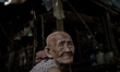 Kampong Pluk, Tonle Sap, Cambodia. An elderly woman suffering from cataracts and unable to...