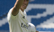 Mariano Diaz Mejia reacts on the pitch after being announced as a Real Madrid player at Sa...