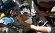 Students finalize their robot car for the race. A robots race took place in Toulouse. Mach...
