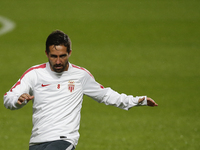 Monaco's player Joao Moutinho warms up during a training session on the eve of the Champions League football match opposing SL Benfica to AS...
