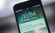 A message appears on an Apple iPhone lock screen notifying the user the device is not back...