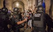 Riot policemen charge to the protesters in the entrance of Catalonia Parlament during the...