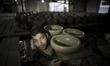 A boy carrying crockery at a pottery workshop in Gaza city, on June 6, 2013.

Photo: Ahm...