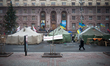 A man on the phone walk by  anti protester tents in maidan square on February 12, 2014. Ru...