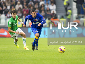  Andrea Costa and Carlos Tevez during the Serie A match between Juventus FC and Parma FC. at Juventus Stafium  on november 9, 2014 in Torino...