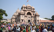 An Indian priest worships five-year old Hindu girl , dressed as the Hindu goddess Durga, a...