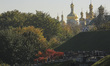 People walk in the park in front of Kyiv Pechersk Lavra (Kiev Monastery of the Caves) on t...
