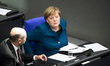 German Chancellor Angela Merkel (R) is pictured in  Bundestag in Berlin, Germany on Octobe...