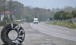 A tire placed next to a road shows the direction of a tire shop on the outskirts of Caycum...