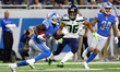 Detroit Lions wide receiver Brandon Powell (10) runs the ball under the pressure of Seattl...