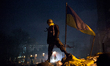 An anti-government protester stands on a barricade in Kiev, on February 15, 2014. Proteste...