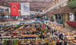 On 27 Oct. 2018, shoppers walk through aisles of fruits and vegetables in the Women's Baza...