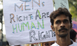 An Indian man walking in a rally to celebrate International Men's Day in Kolkata, India....