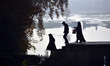 Kashmiri local people walks  in the Nishat Mughal garden during the autumn season in Srina...