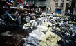 Protesters fortify the barricade on Hrushevskoho street with sandbags 