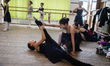 Students stretch during rehearsal of first act of the Nutcracker, ballet scored by Pyotr T...