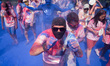 Participant on the blue powder station. Dubbed as the “Happiest 5K on the Planet”, the col...