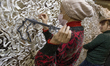 KIEV, UKRAINE - NOVEMBER 23: Volunteers knit a military camouflage nets in Kiev 