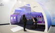 Visitor sit inside a model of Airbus A350 XWB cabin during Japan Aerospace 2018 air show i...