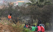 A group of refugees seating near the border fence at the Morocco–Spain border in the city...