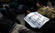 Protesters have gathered in Water Tower place on the morning of Black Friday, and then wal...