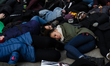 Protesters have gathered in Water Tower place on the morning of Black Friday, and then wal...
