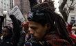 Protesters have gathered in Water Tower place on the morning of Black Friday, and then wal...