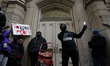 Protesters have gathered in Water Tower place on the morning of Black Friday, and then wal...