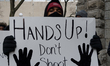 Protesters have gathered in Water Tower place on the morning of Black Friday, and then wal...