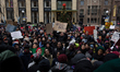 Protesters have gathered in Water Tower place on the morning of Black Friday, and then wal...