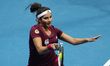 Sania Mirza of the Indian Aces makes a forehand return to Maria Sharapova and Andy Murray...