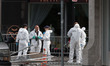 BOSTON - 04/16/13 - A forensics team works outside the entrance of Frette on Boylston stre...