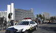 Police car seen pass in  front of Tokyo Detention Center, where former Nissan chairman Car...