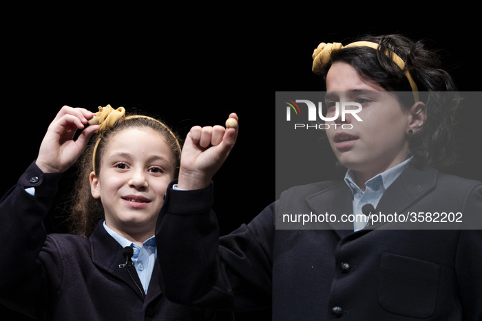 Pupils of the San Ildefonso school, hold a ball bearing of a prize winning number during the draw of Spain's Christmas lottery named 'El Gordo' (Fat One) at the Teatro Real on December 22, 2018 in Madrid, Spain. This year's winning number will be awarded w