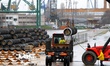 Workers arrange pipes delivered for construction of the South Stream gas pipeline and load...