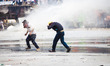 ISTANBUL, TURKEY--Protesters, among them allegedly some police provocateurs, are hosed by...