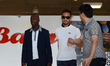 Clarence Seedorf (L) and Hidetoshi Nakata (C) arrives at Suvarnabhumi Airport in Samut Pra...