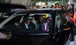 Clarence Seedorf sits in a car after arrives at Suvarnabhumi Airport in Samut Prakan, Thai...