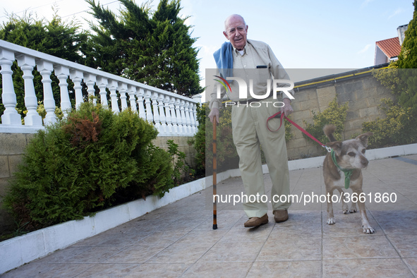An old man walks to Miko in the gardens of the San Cipriano Residence in Soto de la Marina, Cantabria, Spain, on 16 January  in one of the t...